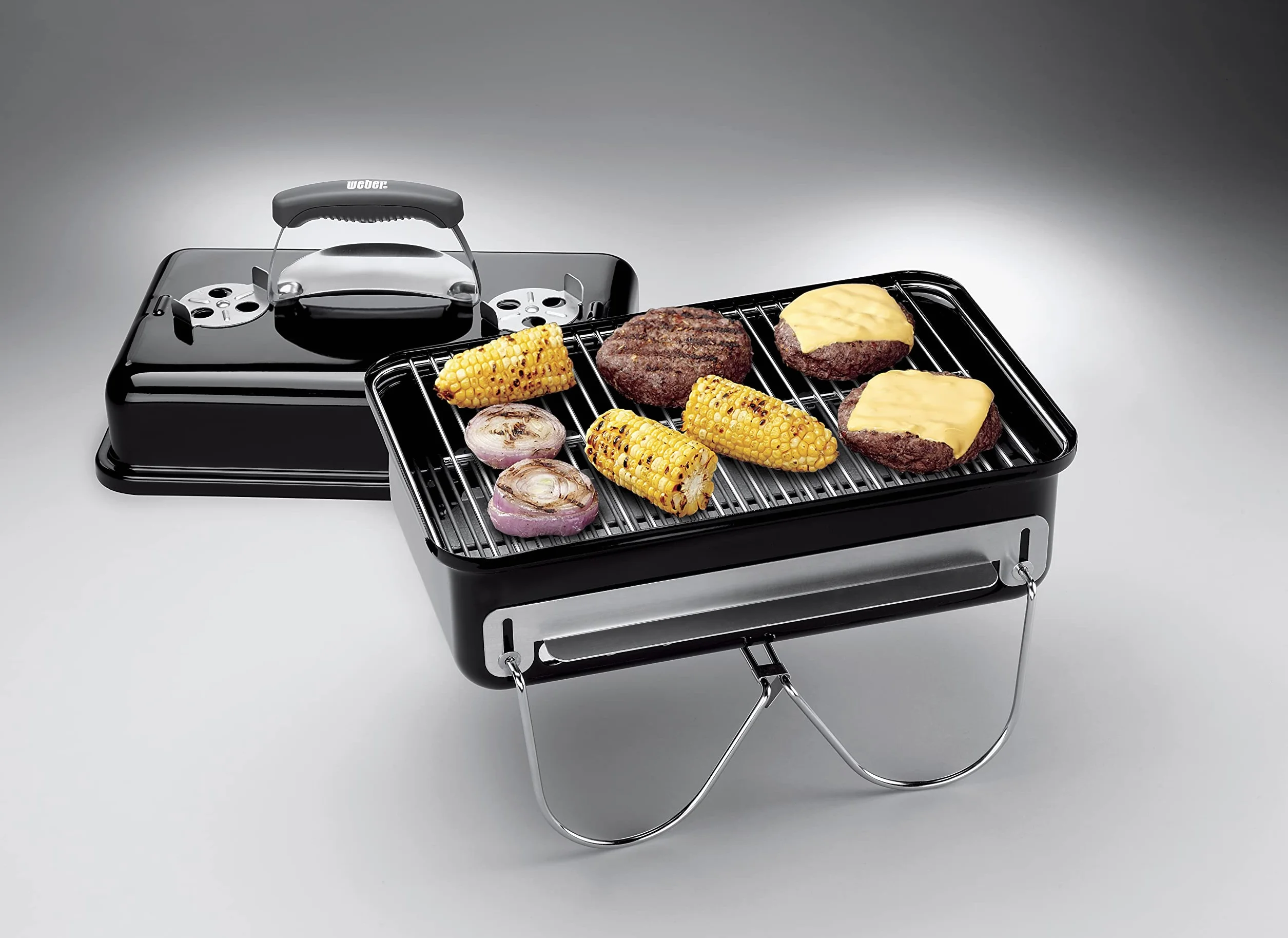 Weber Go-Anywhere Grill węglowy, powierzchnia grilla 42 x 26 cm, lekki przenośny grill BBQ, grill z emaliowaną misą i pokrywą, składane nóżki - Czarny (1131004)