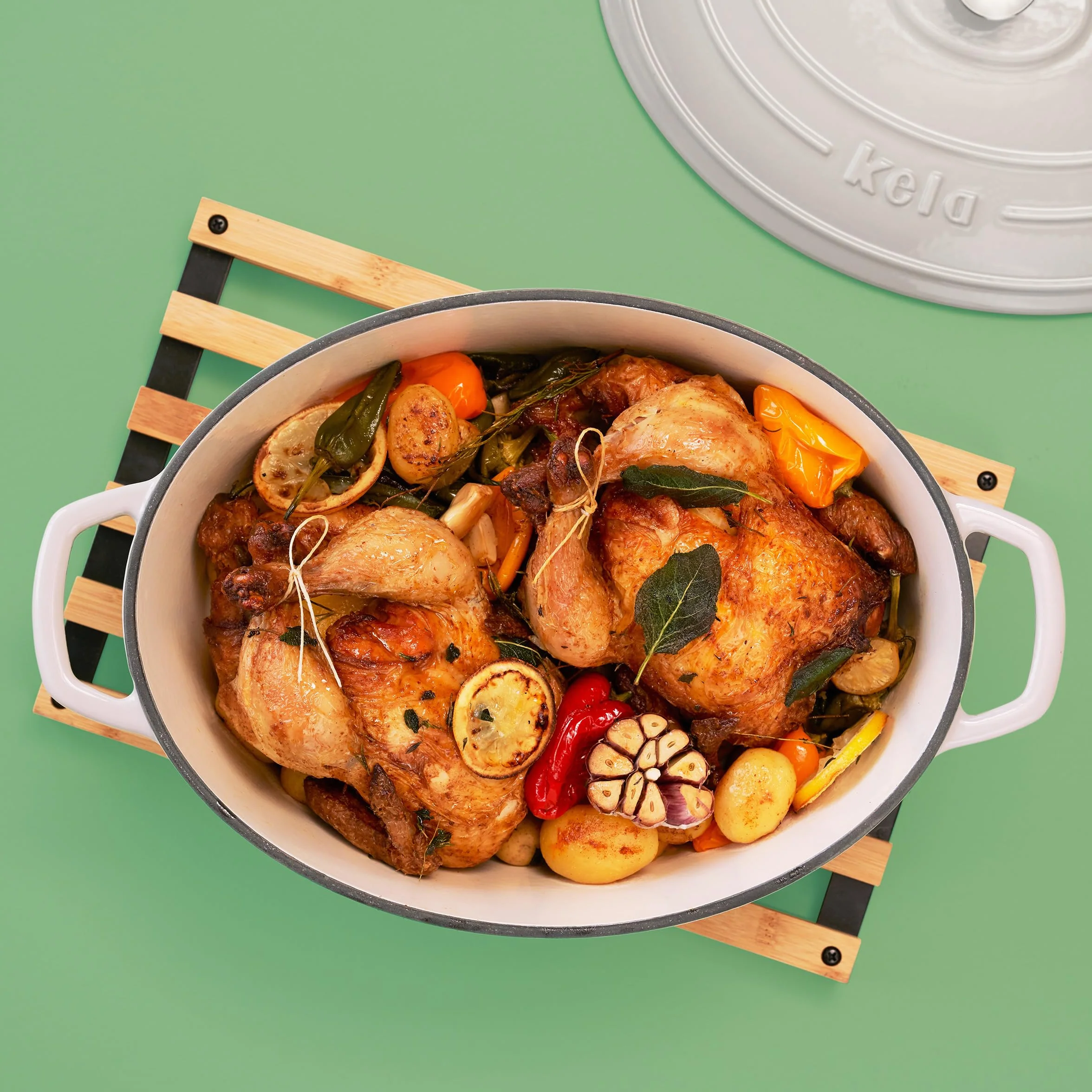 kela Garnek żeliwny owalny 9,3 litra Dutch Oven CALIDO indukcyjny z pokrywką emaliowany jasnoszary