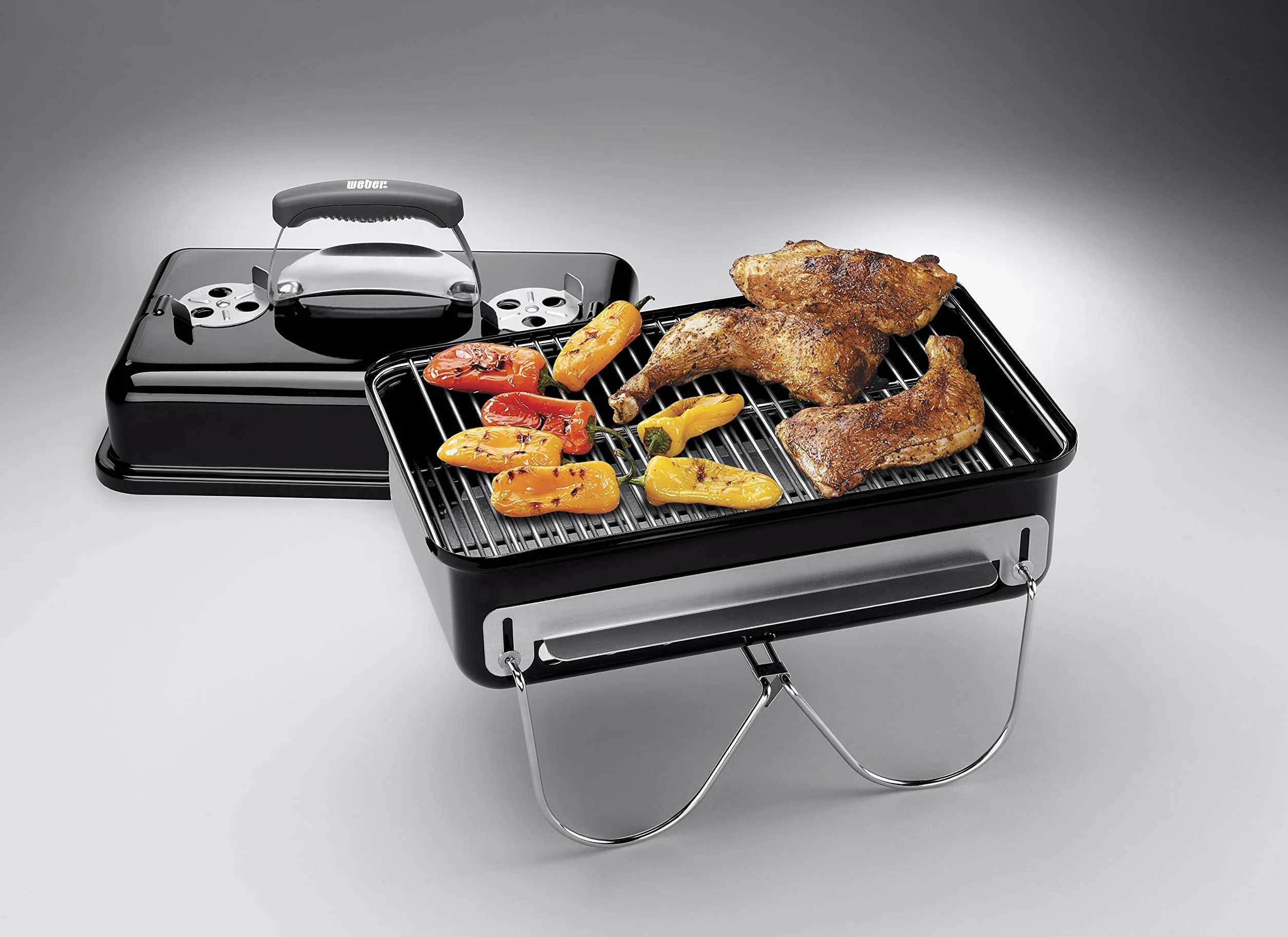 Weber Go-Anywhere Grill węglowy, powierzchnia grilla 42 x 26 cm, lekki przenośny grill BBQ, grill z emaliowaną misą i pokrywą, składane nóżki - Czarny (1131004)