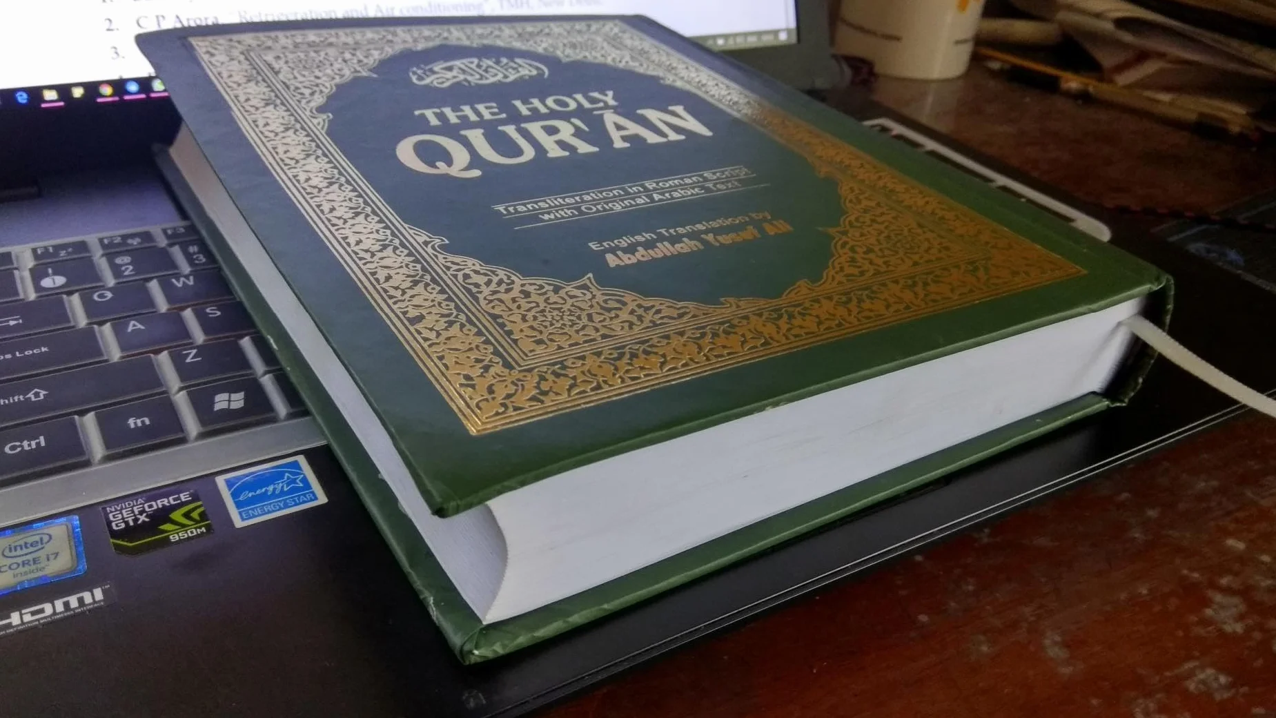 The Holy Qur'an: Transliteration in Roman Script with Arabic Text and English Translation
